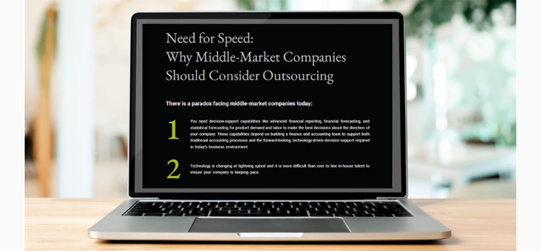 Laptop showing the complete guide to outsourcing finanace